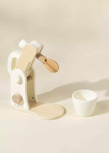 Wooden stand mixer styled in a play kitchen setting