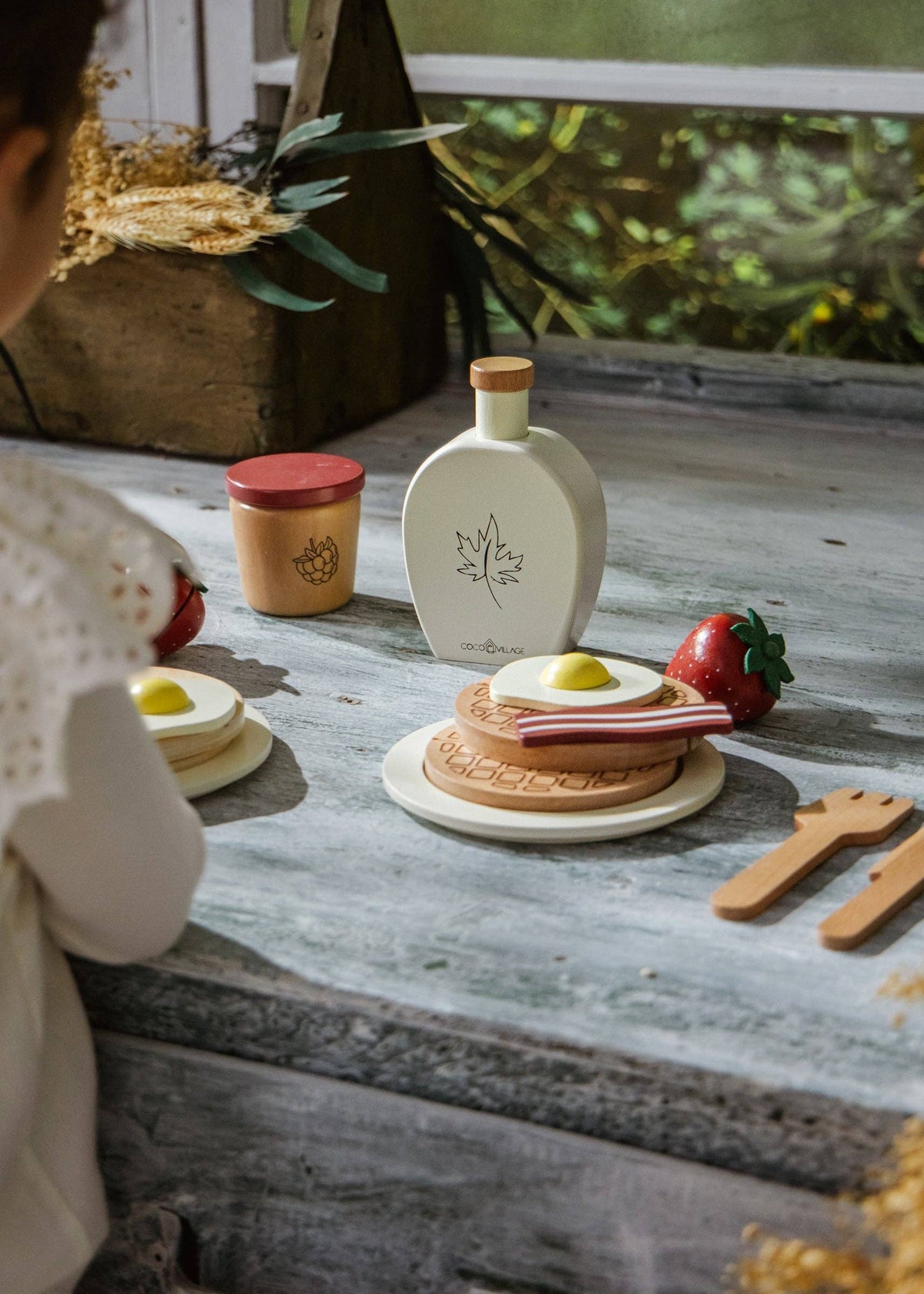 Wooden pretend eggs, bacon, and pancakes from brunch playset