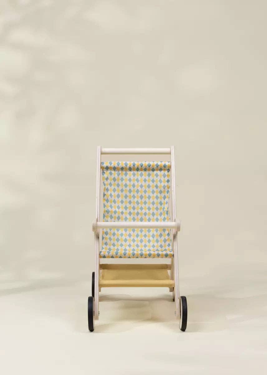 Wooden doll stroller styled with a doll inside