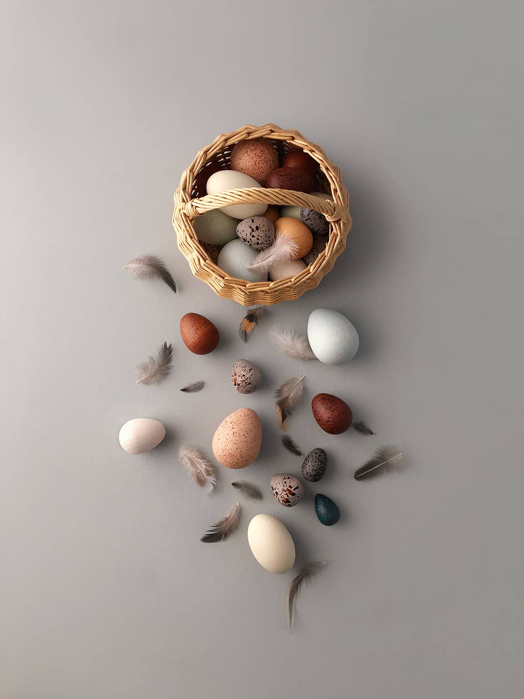 Moon Picnic bird eggs in rattan basket, overhead view