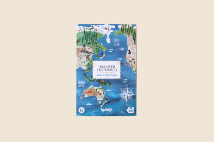 Jigsaw puzzle box with world map design on a blue background
