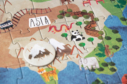 Children's puzzle map of Asia with animals and landmarks