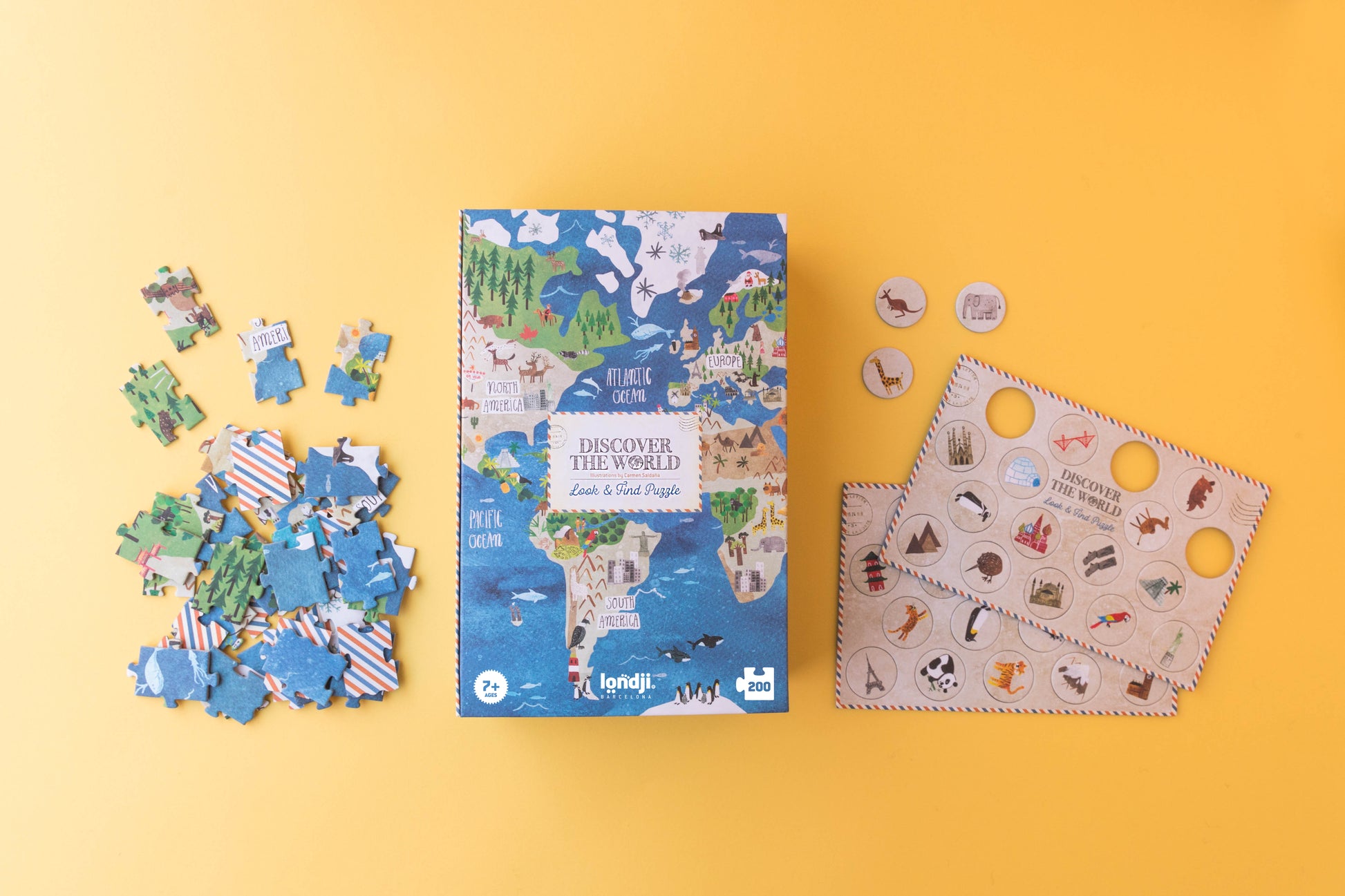 Children's puzzle set with world map design on a yellow background
