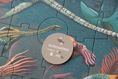 Jigsaw puzzle piece with a label of 'Nchthosaurus' and marine creature illustration.