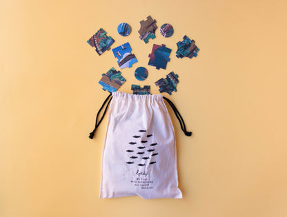 Drawstring bag with colorful geometric shapes on a yellow background