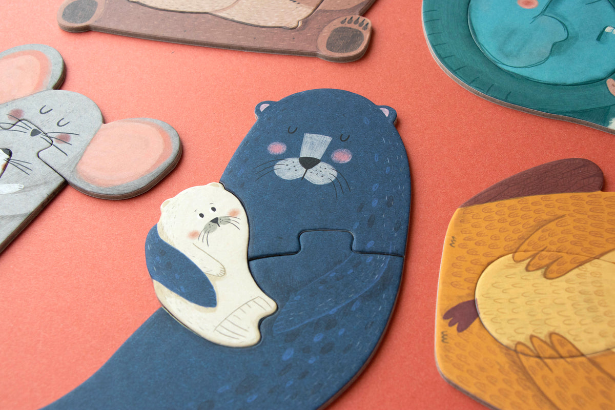 Set of animal-shaped coasters on a red surface