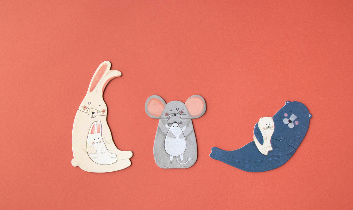 Three cartoon animal figures on a red background