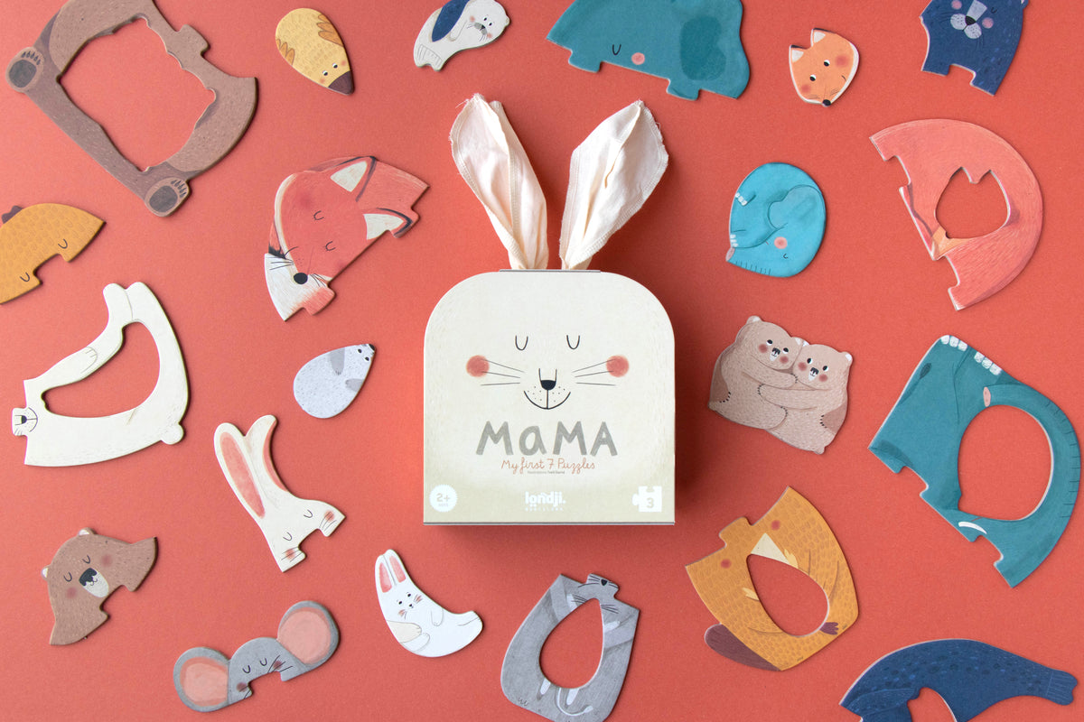 Box labeled 'MAMA' surrounded by various animal-shaped cutouts on a red background