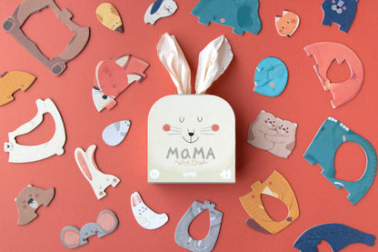 Box labeled 'MAMA' surrounded by various animal-shaped cutouts on a red background