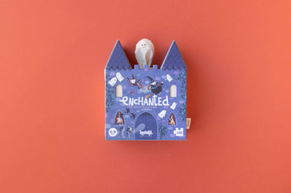Blue castle-shaped box with a white plush toy on an orange background