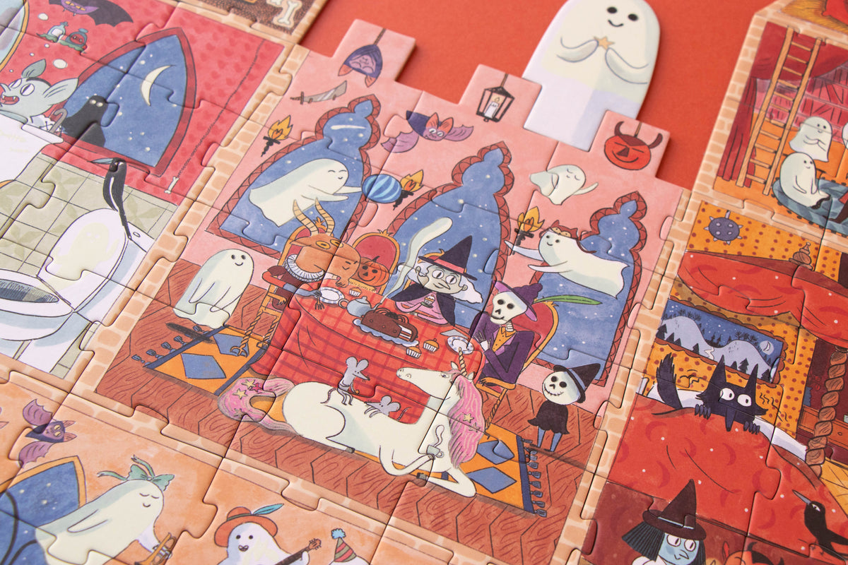 Halloween-themed puzzle with ghost, cat, and witch illustrations on a red background