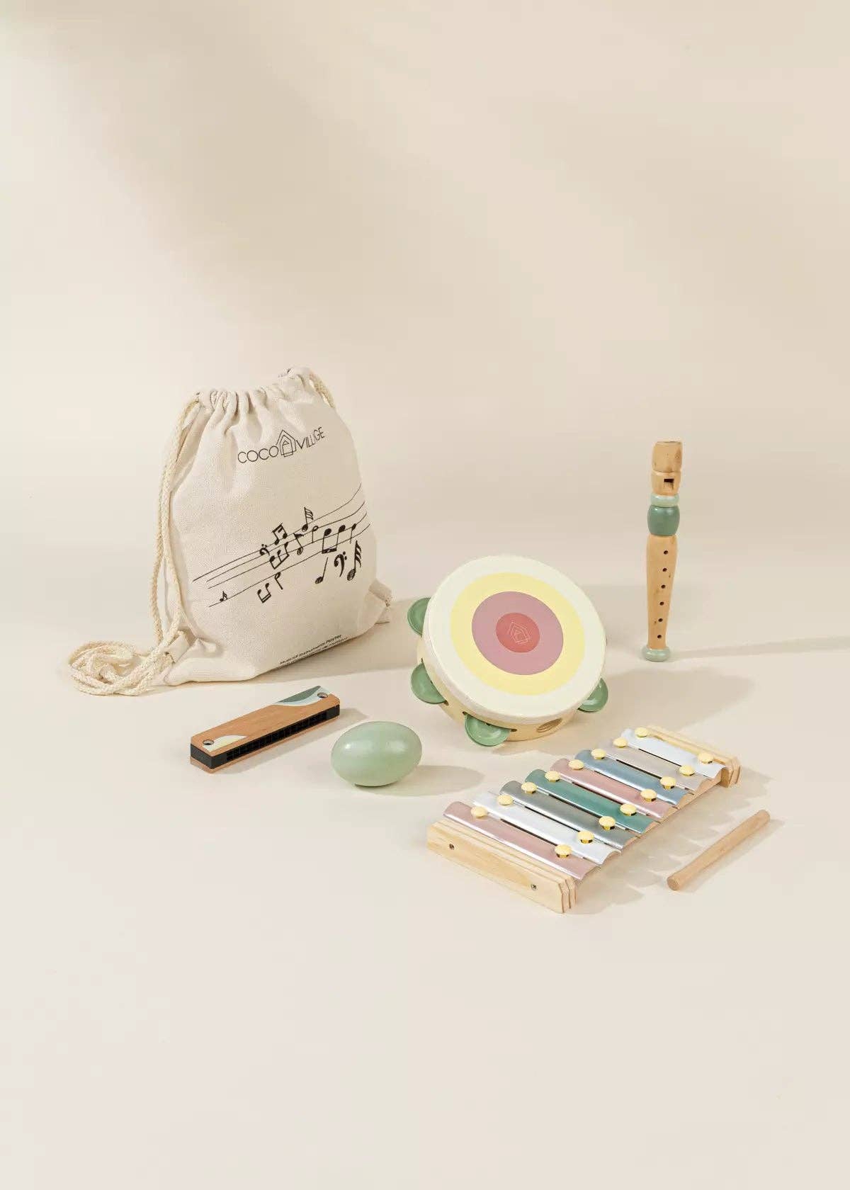 Child playing with wooden musical instruments - Montessori sensory toy