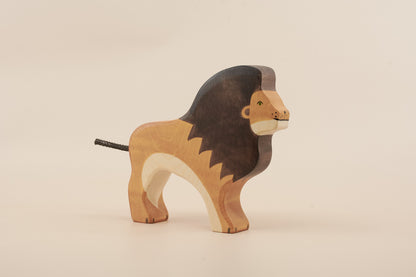 Wooden lion toy on a beige background
